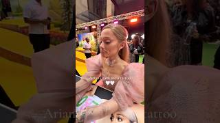 Ariana Grande DRAWS tattoos for fans at wicked premiere [upl. by Notniw]