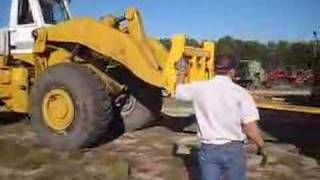 Unloading A 11 Ton 9500 John Deere Combine with Hough 560 [upl. by Viveca]