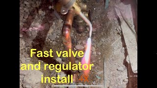 Installing a main water valve and regulator in a hole [upl. by Sairtemed]