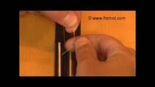 Changing Classical Guitar Strings  Winding String Around Tie Block [upl. by Anelet]