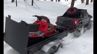 Rc SNOWMOBILE skidoo new bright on snow jumping4x4 redcat clawback trailer adventure [upl. by Harobed]