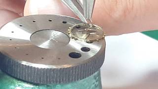 Attaching a watch hairspring onto balance wheel [upl. by Rape]