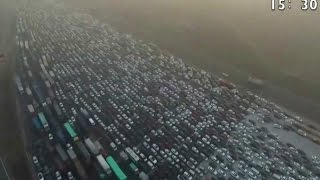 Watch the incredible footage of a 50lane holiday traffic jam in China [upl. by Doownelg306]