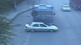 Dramatic CCTV of China car crash Freight truck pushes car forward 500 metres [upl. by Marchal402]