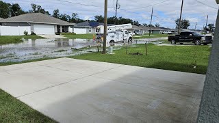 Flooded neighborhood traps cars in driveways utility vehicles while repairing power [upl. by Aillicsirp]