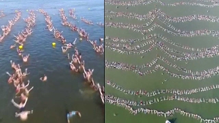 Around 2000 people float together in Argentina for a world record [upl. by Eenert]