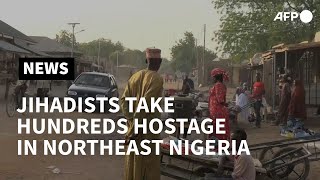 Islamic State allies take hundreds hostage in Nigerian town  AFP [upl. by Audrye371]