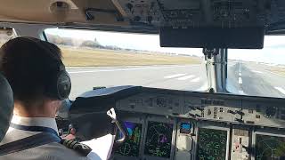 Dash 8 Q400 cockpit landing in Warsaw WAW gusty wind [upl. by Lilahk337]