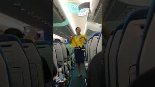 Flight stewardess doing a short briefing for passenger’s safeness [upl. by Elinad]