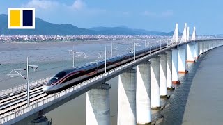 China launches first crosssea bullet train line [upl. by Blockus141]