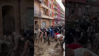 Volunteers sweep water after DEADLY Spain floods [upl. by Nylram908]