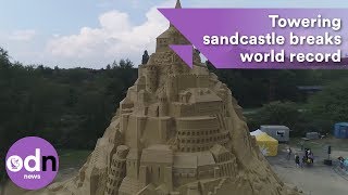 Towering sandcastle breaks world record [upl. by Aenert]