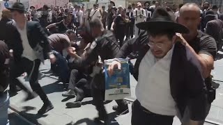 Orthodox Jewish protesters against military service law forcibly removed by police in Jerusalem [upl. by Akieluz]