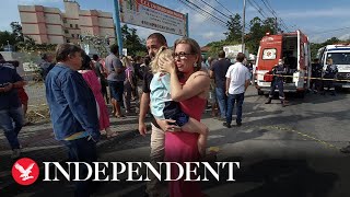 Man kills four children with hatchet after climbing over wall into nursery in Brazil [upl. by Honorine]