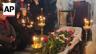 Alexei Navalnys coffin arrives at Moscow cemetery [upl. by Ahsiet857]