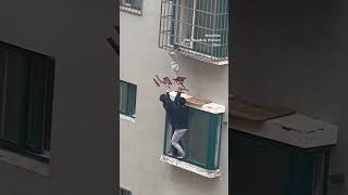 Neighbours rescue boy dangling from 4thfloor window in China ytshorts [upl. by Naerb]