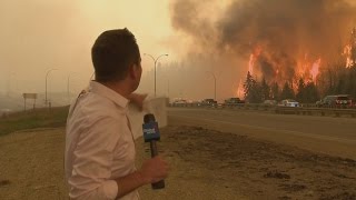 Caught on camera Fort McMurray fire erupts behind Global News reporter [upl. by Noryd]