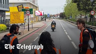 Moment motorcyclist rams past Just Stop Oil protesters blocking the road [upl. by Euhc]