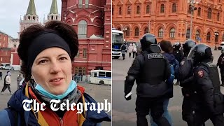 Police arrest Russian peace protester within seconds of starting interview [upl. by Yelreveb]