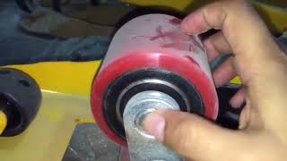 How to Change Hand Pallet Trucks Roller Wheels [upl. by Yslek325]