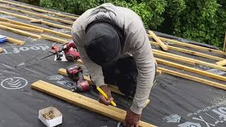 Battening the roof in preparation for the Velux and tiles [upl. by Anoved984]