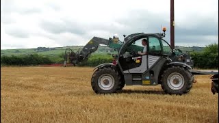 Stacking and carting straw bales with a Kramer kt 356 and a Massey Ferguson 6465 [upl. by Etnaed]