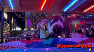 A brave girl in a dress Riding on a mechanical Bull in Benidorm [upl. by Ravid]