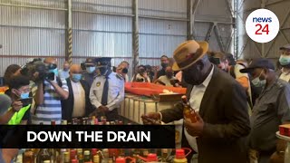 WATCH  Bheki Cele flushes 20 000 litres of illegal alcohol during festive season tour [upl. by Riegel]