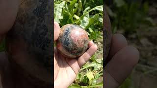 Polished rhodonite sphere afghanistan afghanite quartz afghanjewelry crystals gems gemstones [upl. by Astri]