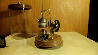 Stirling engine with musicbox in glass tube [upl. by Llevel]