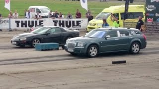 Chrysler 300c 57 Hemi vs Chevrolet Camaro 38 V6 14 mile drag race [upl. by Ynot]