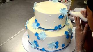 How to Decorate a two tier cake with fondant flowers [upl. by Eiralam]