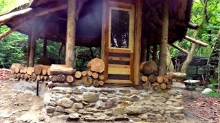 Off grid roundhouse build part 12 cordwood walls lime plaster and flooring [upl. by Ecyak]