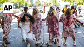 WATCH Thousands dress up as zombies at Chiles annual zombie walk [upl. by Dalohcin]