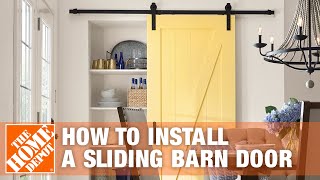 How to Install a Sliding Barn Door  The Home Depot [upl. by Ellehcor307]