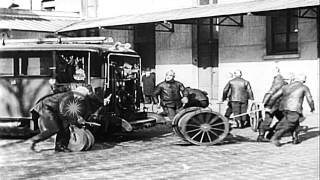 Firemen rush to a building on fire on a fireengine sedan and puts out the firHD Stock Footage [upl. by Reivaj]