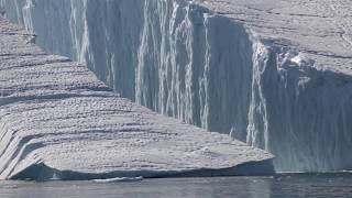 Large Iceberg Breaking near Ilulissat [upl. by Ellehcam]