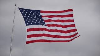 American flag flaps during heavy wind storm [upl. by Yeldahc]