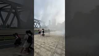 Tide of Qiantang River showers spectators on bridge [upl. by Aray]