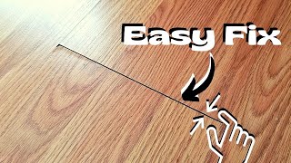 EASY DIY How to QUICKLY Fix a Crack in a Laminate Floor [upl. by Hunfredo]