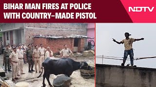 Bihar News  Bihar Man Climbs Onto Roof Fires At Police With CountryMade Pistol [upl. by Aisatana109]