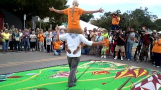 Nik Wallenda with woman on shoulders walks wire [upl. by Ojeitak]