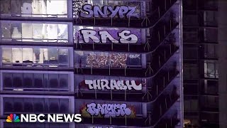 Taggers vandalize around 30 floors of a new Los Angeles highrise [upl. by Chi]