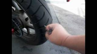 Repairing  Plugging A Motorcycle Tire 100409 [upl. by Tannenwald563]