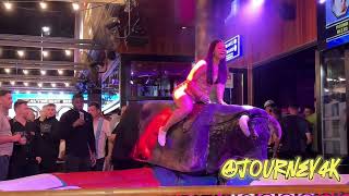 Girl in Beautiful Pink Dress Riding on Mechanical Bull in Benidorm 4K [upl. by Holle]