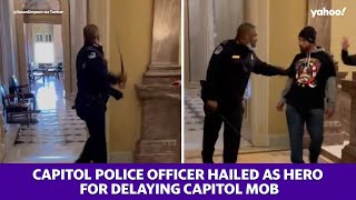 Capitol police officer hailed as hero for delaying Capitol mob [upl. by Lletniuq]