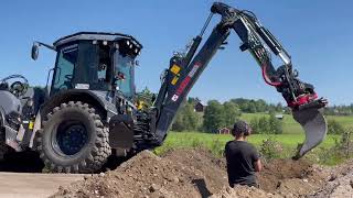 HUDDIG 1260E backhoe loader with Rototilt R4 road excavation for fiber optics [upl. by Nitsir186]