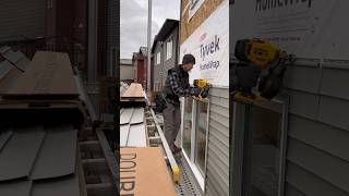 Cutting vinyl siding around a window  install using Siding Tips with Dewalt 20v roofing nailer [upl. by Ibbison473]