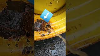 Tractor tire ballast being drained 4 rim change Tube leaked and rotted rim shorts diy superslomo [upl. by Warden646]