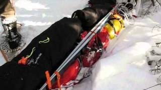 Strapping skis on toboggan sled bags [upl. by Aramo]